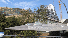 With the retired A-12 Blackbird in the foreground, the diagrid structure for the Shuttle Gallery takes shape at the Samuel Oschin Air and Space Center...on October 4, 2024.